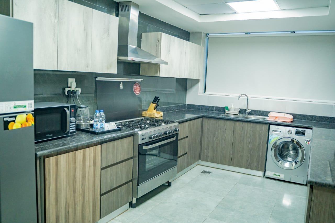 Luxe Grand Hotel Apartments Sharjah Exteriör bild A modern kitchen