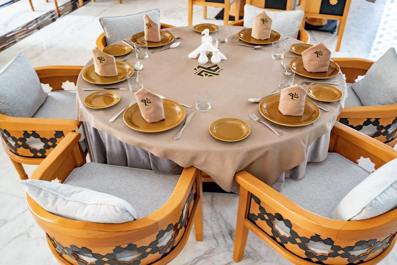 Luxe Grand Hotel Apartments Sharjah Exteriör bild A table set for a Seder