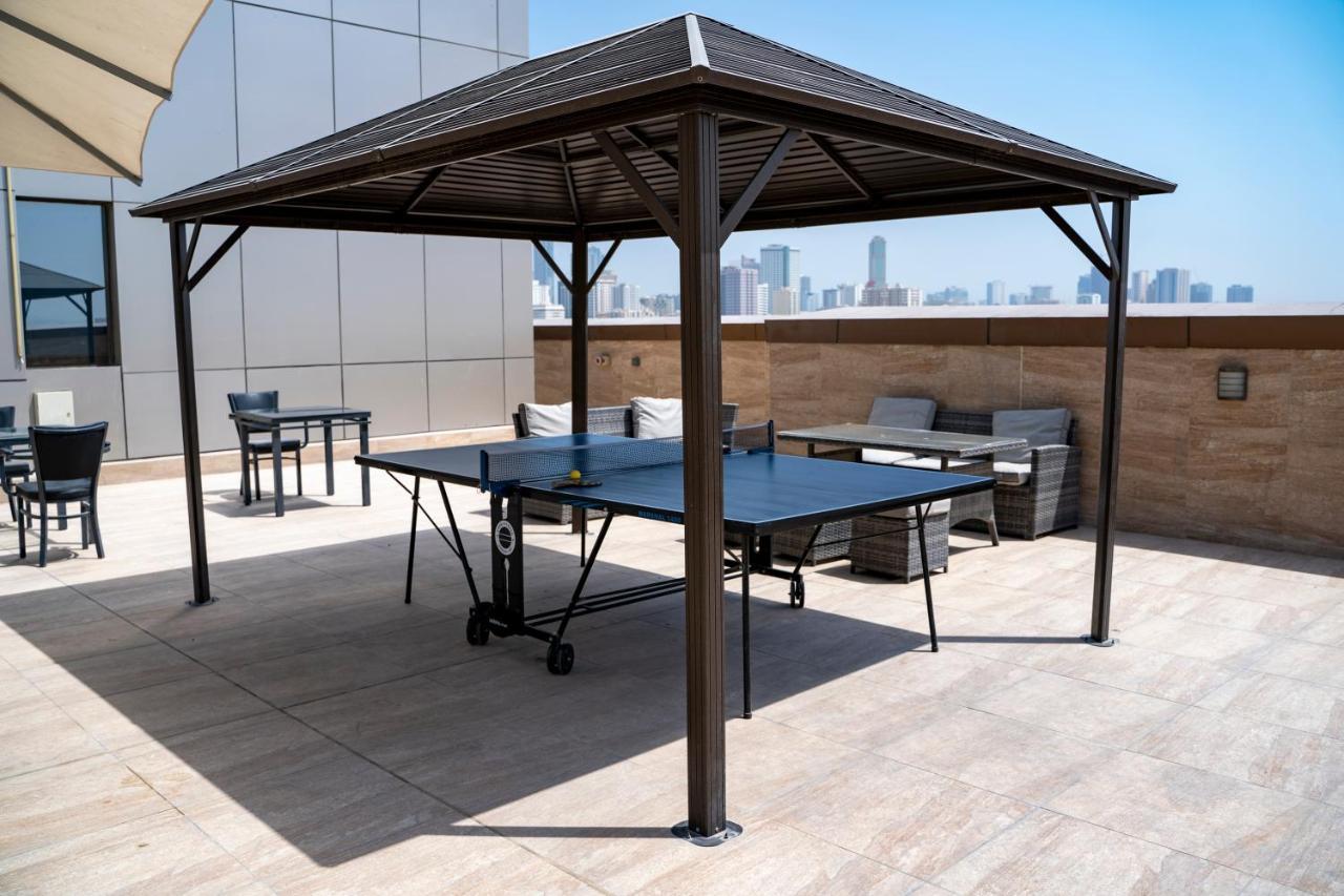Luxe Grand Hotel Apartments Sharjah Exteriör bild A modern metal gazebo