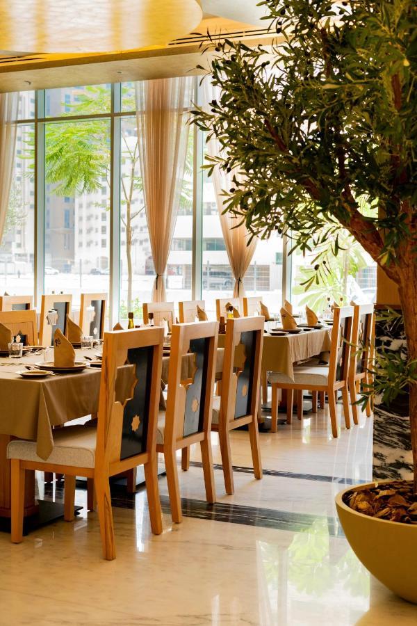 Luxe Grand Hotel Apartments Sharjah Exteriör bild Restaurant