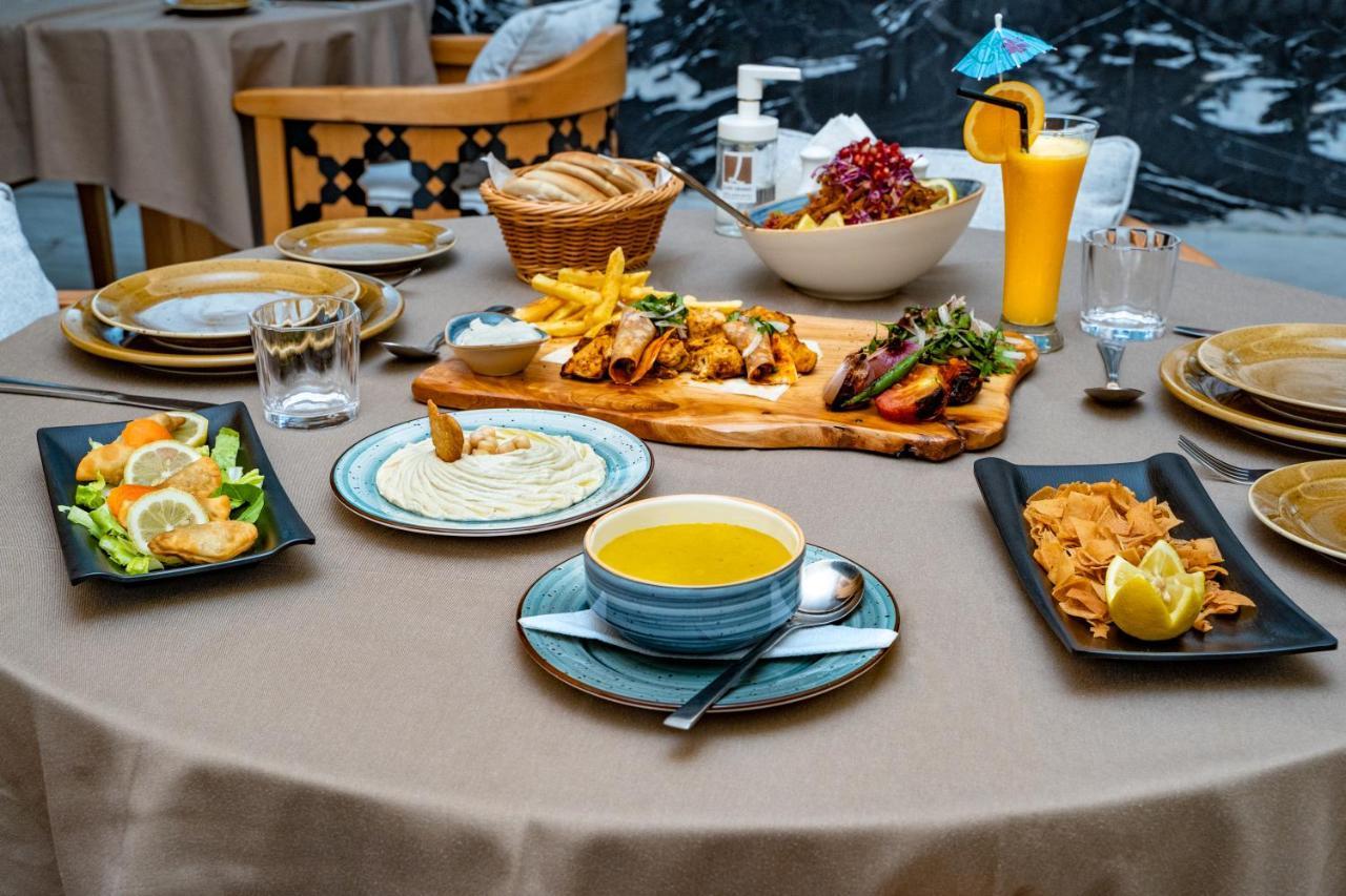 Luxe Grand Hotel Apartments Sharjah Exteriör bild A selection of Turkish cuisine