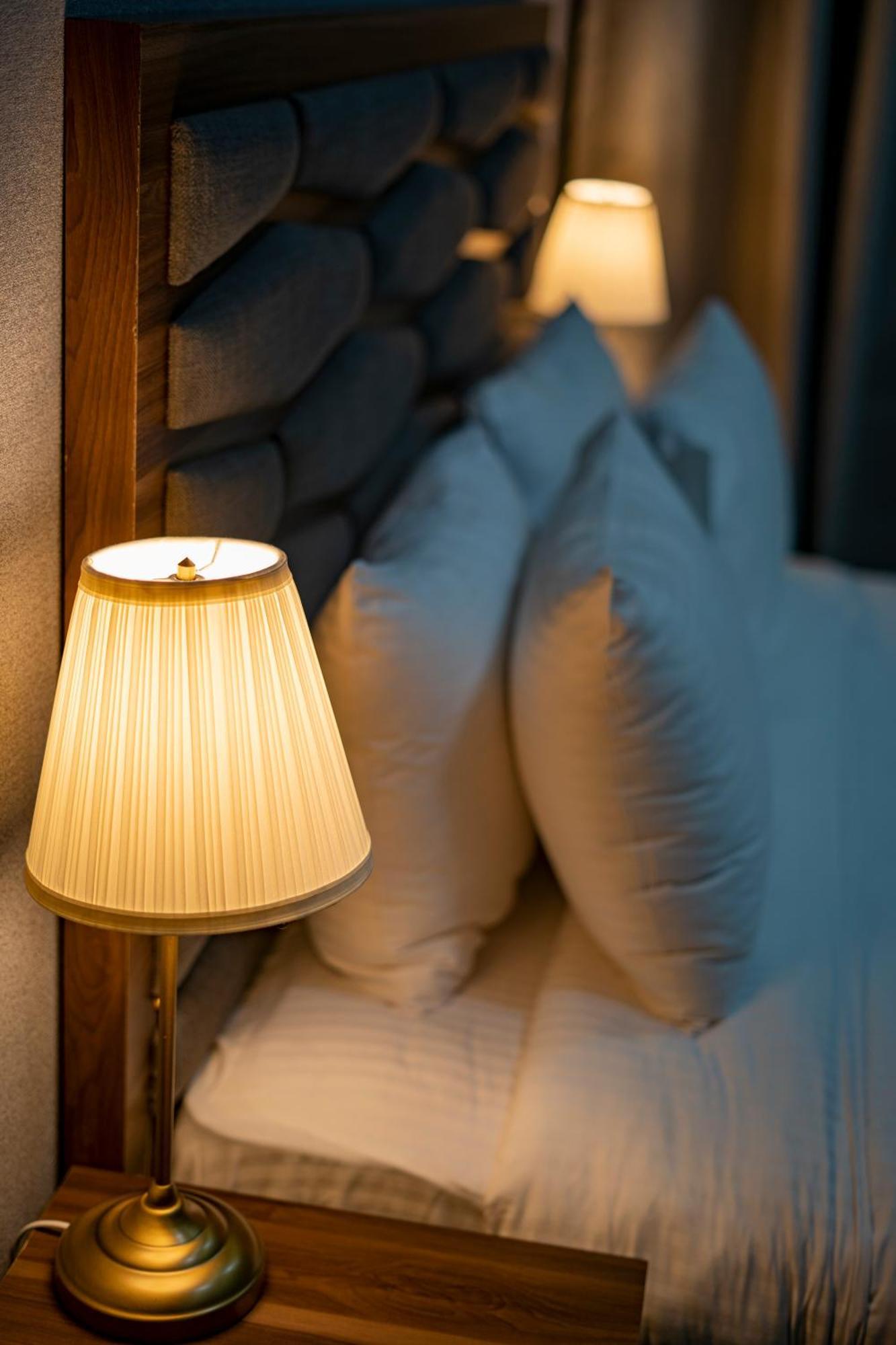 Luxe Grand Hotel Apartments Sharjah Exteriör bild A pleated lampshade