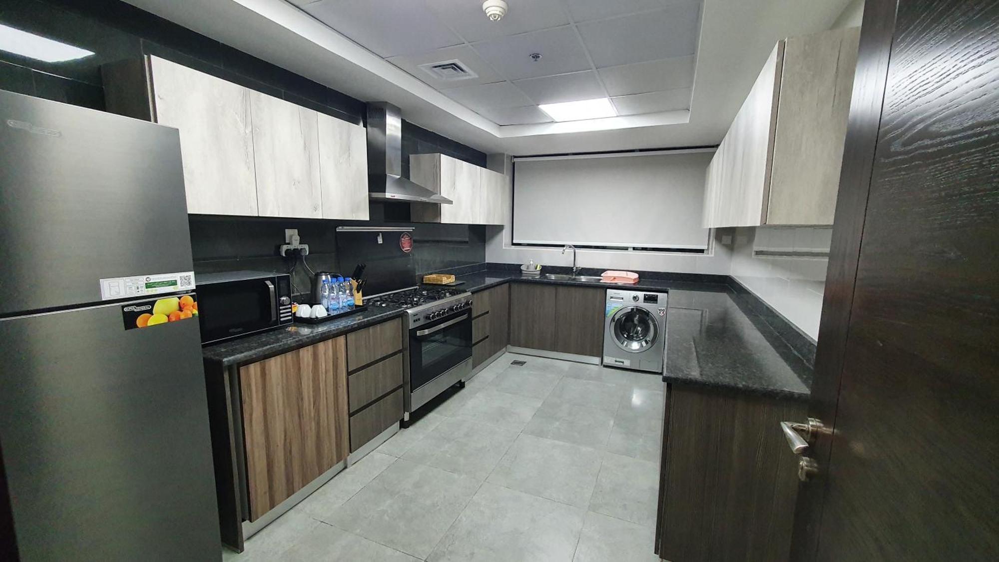 Luxe Grand Hotel Apartments Sharjah Exteriör bild A modern kitchen in Dubai